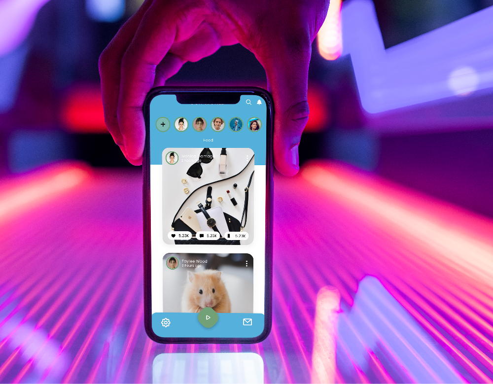 Hand holding a phone showing the app's photo feed with profile pictures across the top